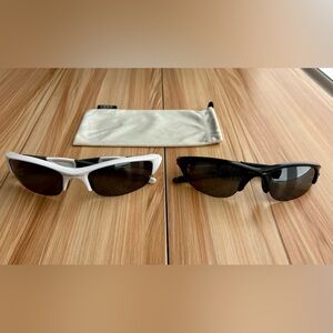 Two Pairs of Oakley Sunglasses with one Oakley bag.